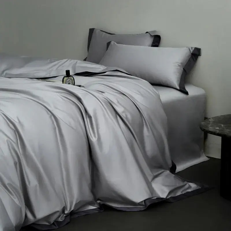 Silver satin duvet cover set with black trim in a cream and lavender egyptian cotton hotel style bedding set bedroom