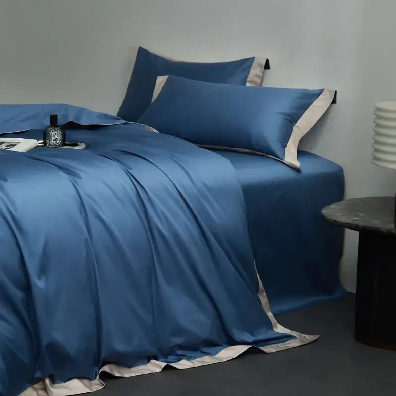 Blue satin bedding set with cream piping in cream and lavender egyptian cotton hotel style bedroom