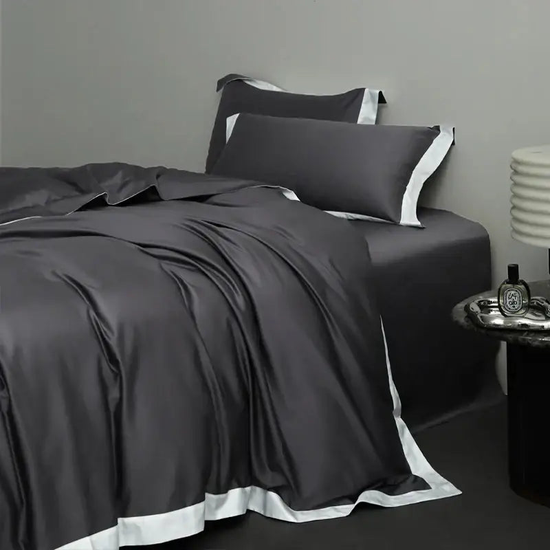 Dark gray satin bedding set with white piping in a cream and lavender egyptian cotton hotel style bedroom