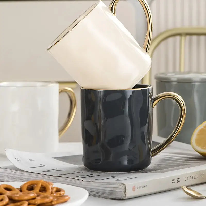 Cream and navy ceramic coffee cups with nordic gold rim stacked gold rim mug set for kitchen use