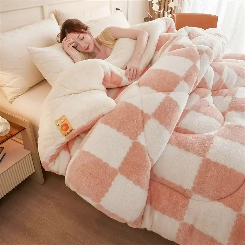 A plush pink and white checkered cream and tan cozy checkerboard cashmere weighted blanket with soft texture