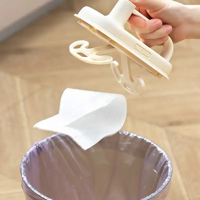 Cream-colored plastic kitchen cleaning brush with handle and suction cup design featuring replaceable silicone head