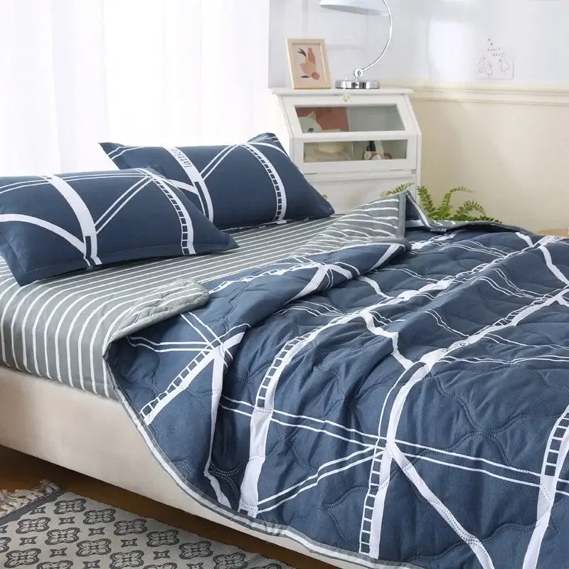 Navy blue bear quilt and pillowcase set with white geometric stitching for a comfortable night’s sleep and stylish bedroom bedding