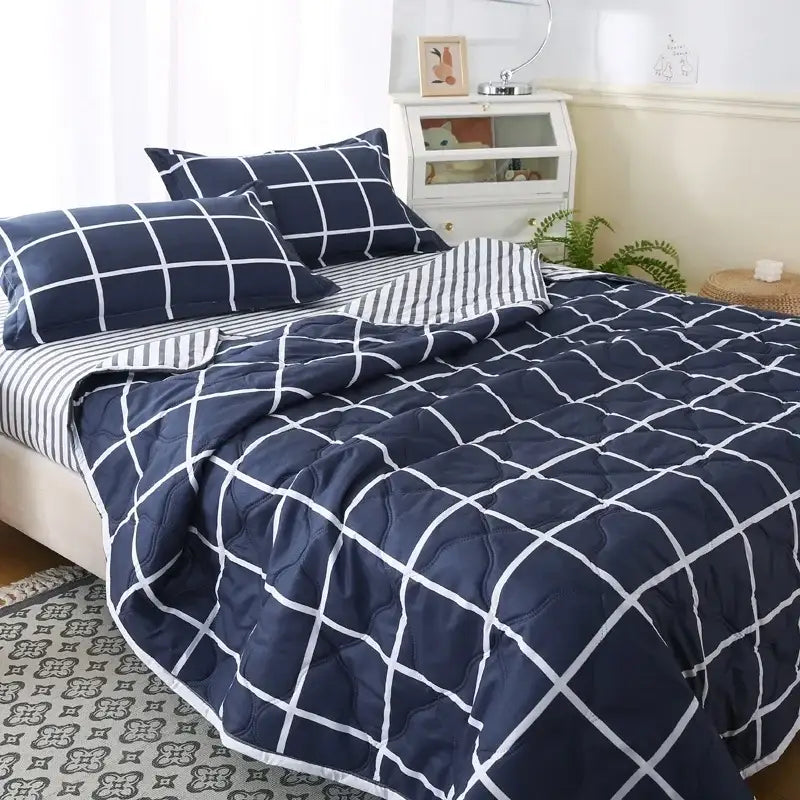 Navy blue quilted bear quilt with white grid pattern and matching pillowcase set in cream bear bedding set