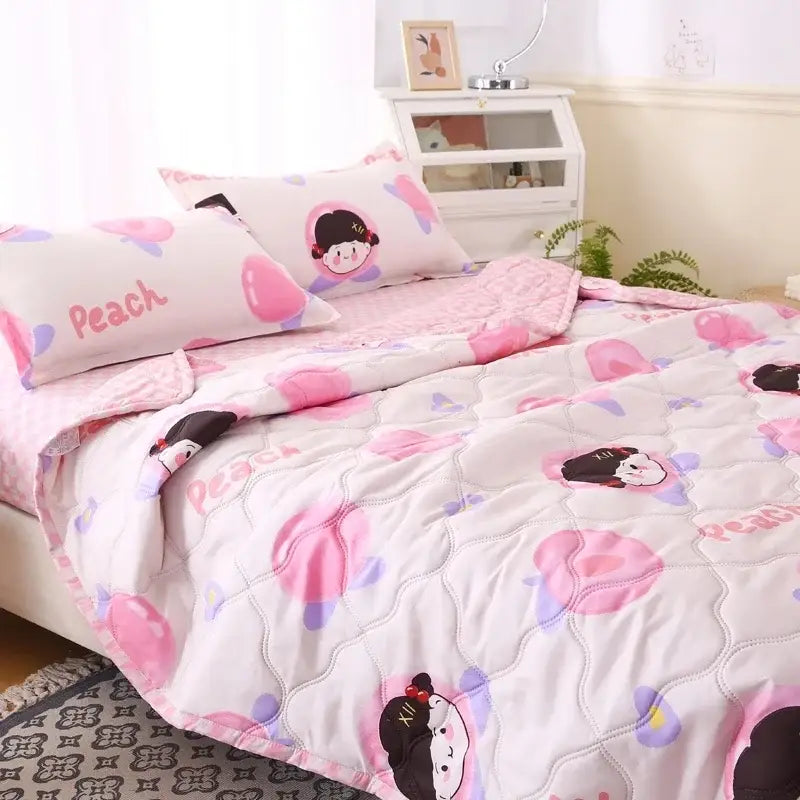 Pink and white quilted bear quilt and pillowcase set featuring cartoon peach characters and purple accents for night’s sleep