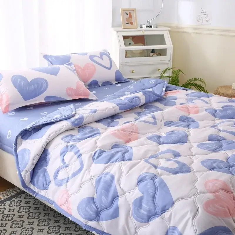 Cream bear quilt and pillowcase set featuring a quilted cotton bedding set with blue and pink heart patterns on white background