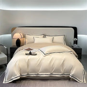 Cream and black egyptian cotton bedding set featuring cream satin with elegant black piping for bedroom linens