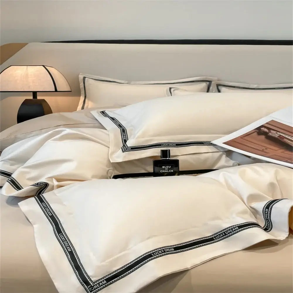Cream and black egyptian cotton bedding set with cream satin pillowcases and black embroidered lucky dream trim