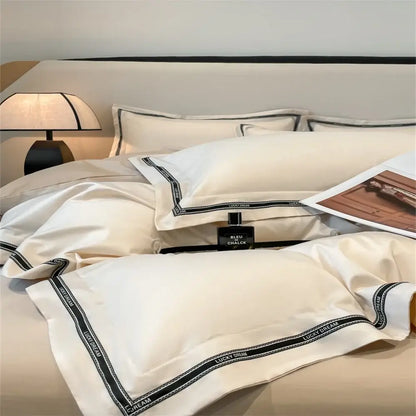 Cream and black egyptian cotton bedding set with cream satin pillowcases and black embroidered lucky dream trim