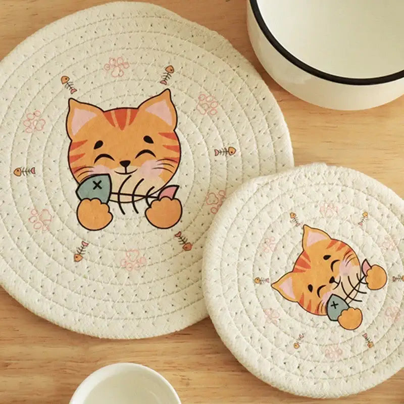 Cream braided rope cat print round coaster in cream quilted fabric featuring a cartoon orange tabby cat print fish bones