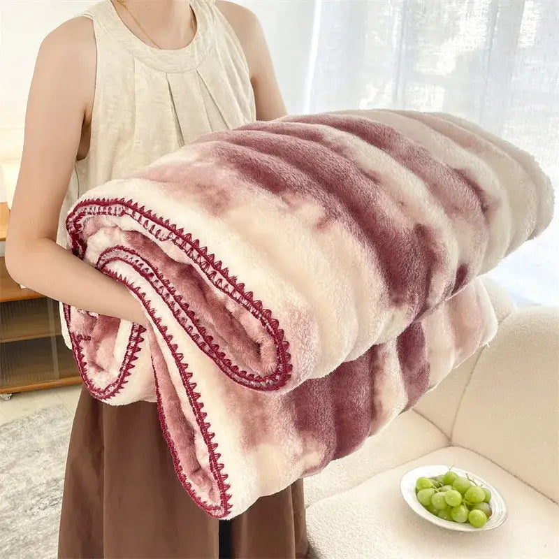A plush marbled pink and mauve decorbites bubble velvet woolen sofa blanket with red zigzag stitching for living room decor