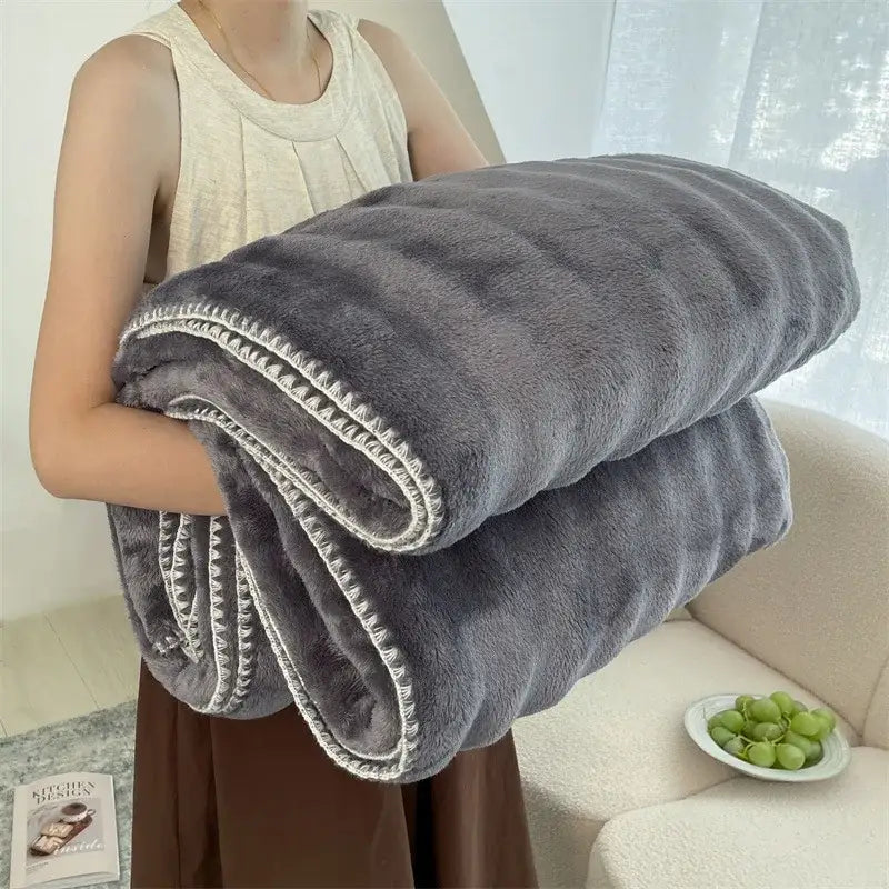 A plush gray cream bubble velvet woolen sofa blanket with textured fuzzy surface and white zigzag stitching edges for living room throw decorbites bubble velvet
