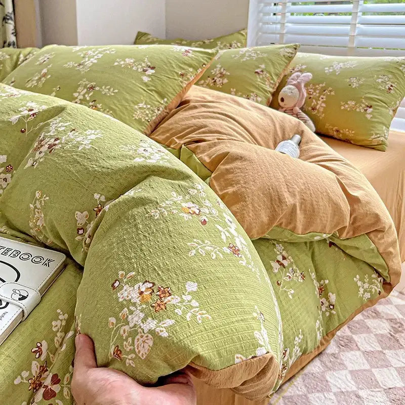 Soft green floral-patterned quilt bedding set with cozy fabric and matching pillowcases from decorbites cartoon pattern cotton collection