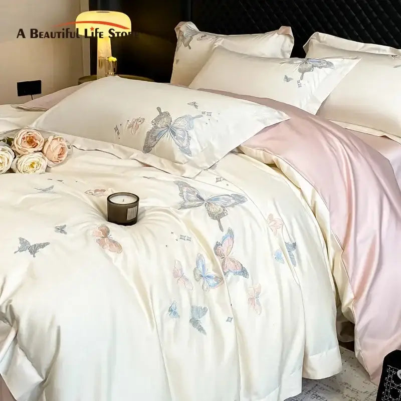 Cream-colored satin bedding set with decorbites butterfly embroidery in pastel shades made from 800tc Egyptian cotton