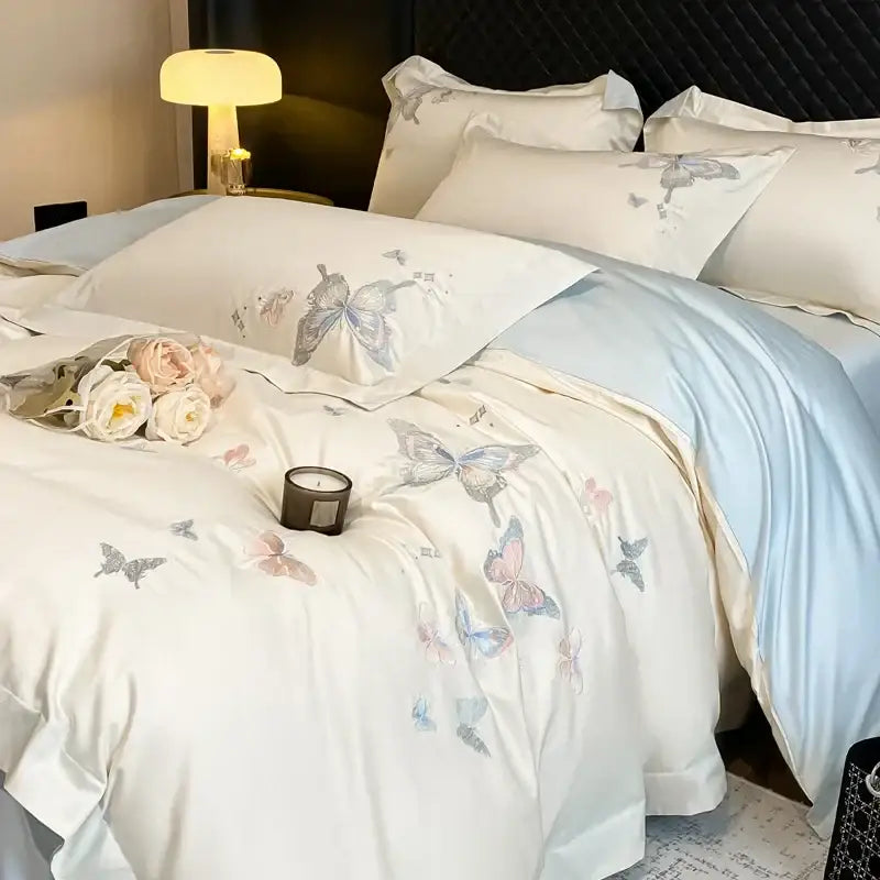 Cream satin bedding set with decorbites butterfly embroidery in pastel shades made of 800tc Egyptian cotton