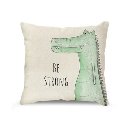 Cream cartoon animal linen pillowcase set with beige cushion featuring a light green crocodile and be strong text decorbites cartoon animal