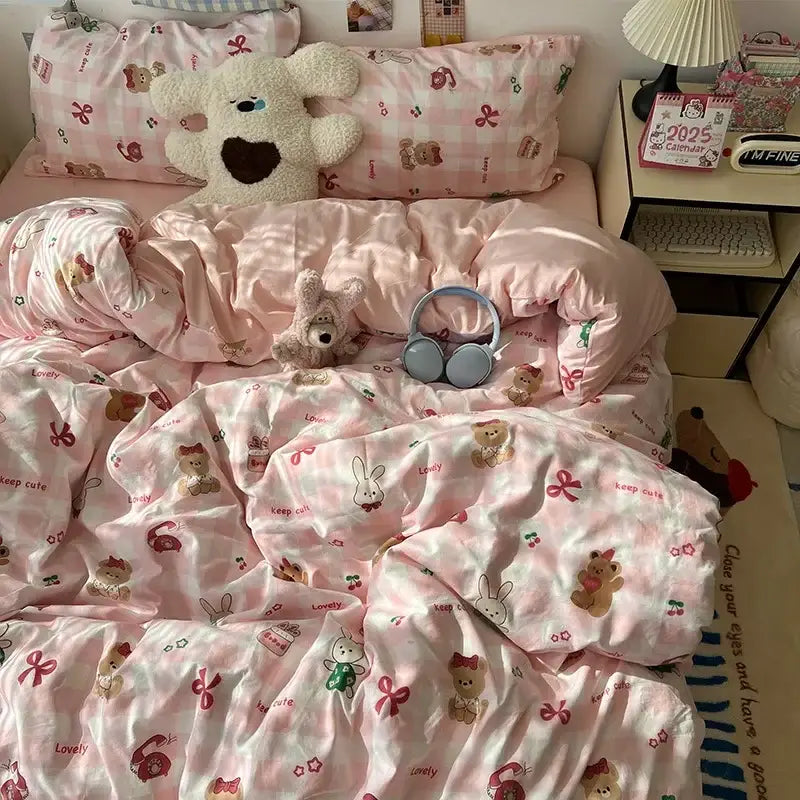 Pink satin bedding set featuring decorbites cartoon pattern of teddy bears bows and keep cute text for bedroom decor