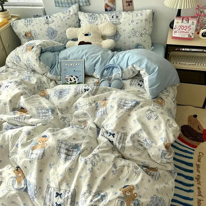 Soft cream bedding set with decorbites cartoon pattern featuring teddy bears, plaid pockets, and delicate blue accents