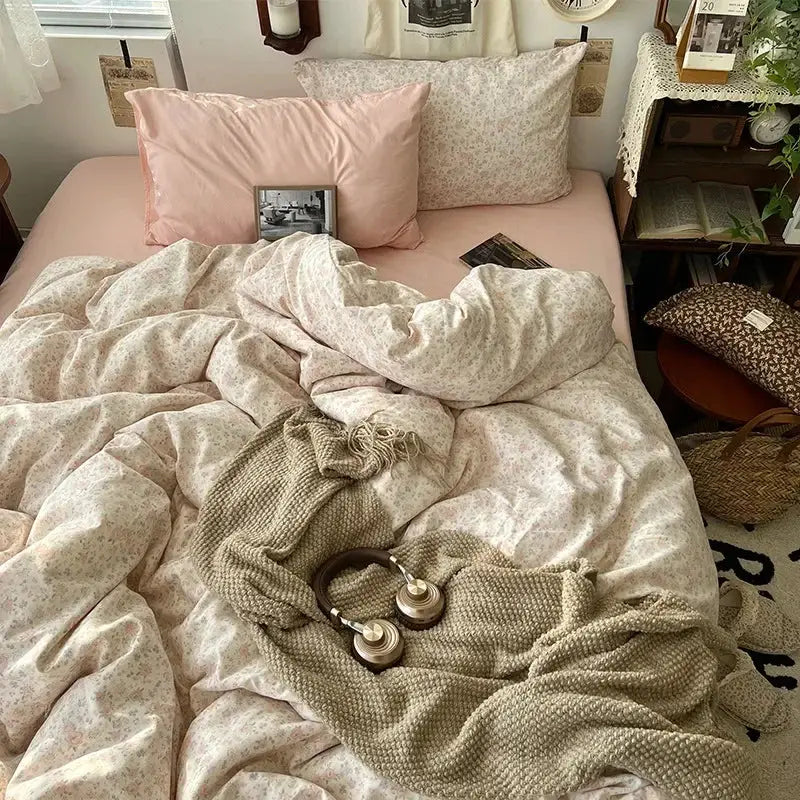 Soft pink floral bedding set with decorbites cartoon pattern printed pillows and textured beige throw blanket