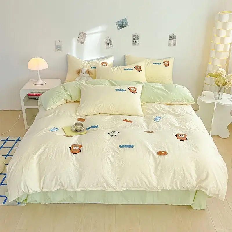 Cream pastel yellow and mint green cartoon embroidery jacquard comforter set with animal-themed bedroom bed linen