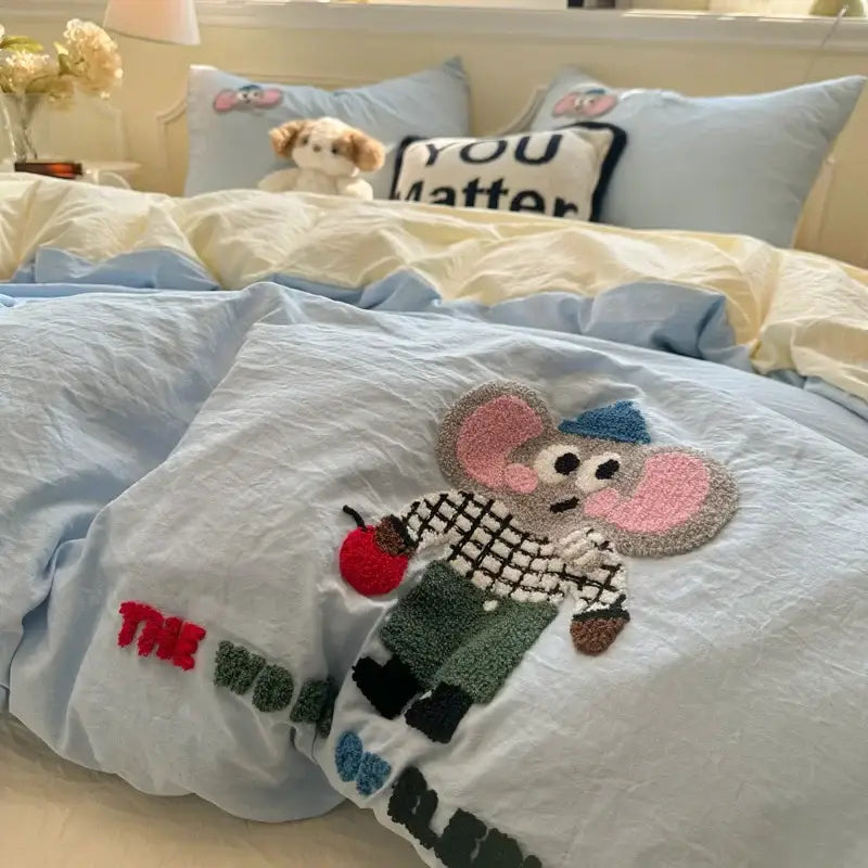 Light blue duvet cover with cartoon embroidery jacquard featuring a plush mouse in checkered shirt and green pants