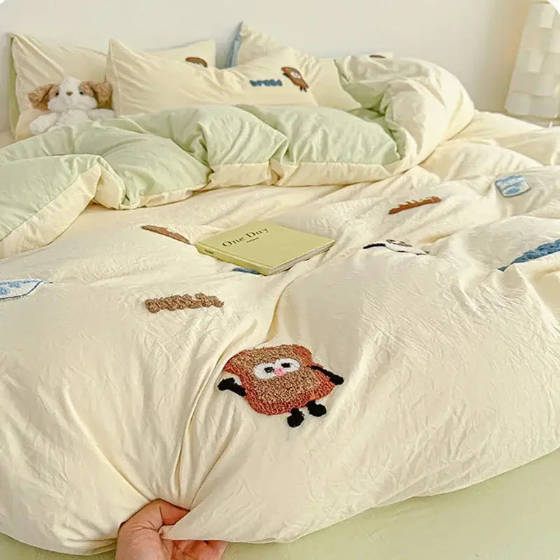 Cream cartoon embroidery jacquard comforter set in cream color with playful embroidered cartoon characters in pastel tones