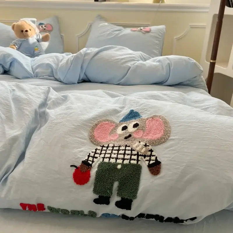 Cream cartoon embroidery jacquard comforter set with a light blue duvet cover featuring plush embroidered cartoon mouse design