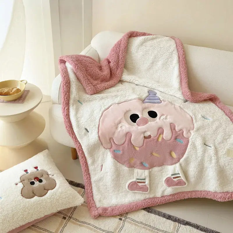 Cream cartoon lamb wool blanket with plush cream color and pink frosting donut appliqué for bedroom decorbites use