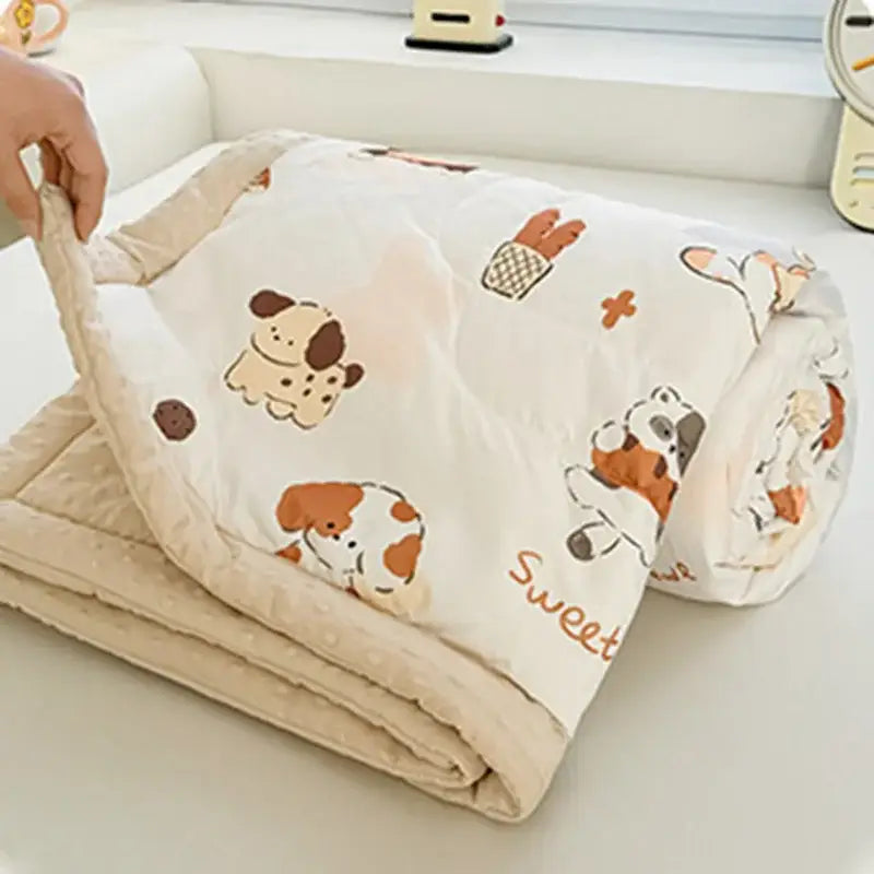 Cream cartoon pattern summer quilt featuring soft cream fabric with decorbites cartoon pattern of dogs and bread baskets