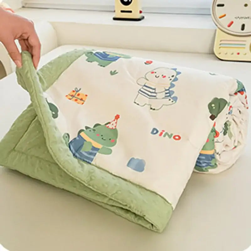 Cream cartoon pattern summer quilt soft duck comforter with a cream dinosaur print and green minky border from decorbites cartoon pattern
