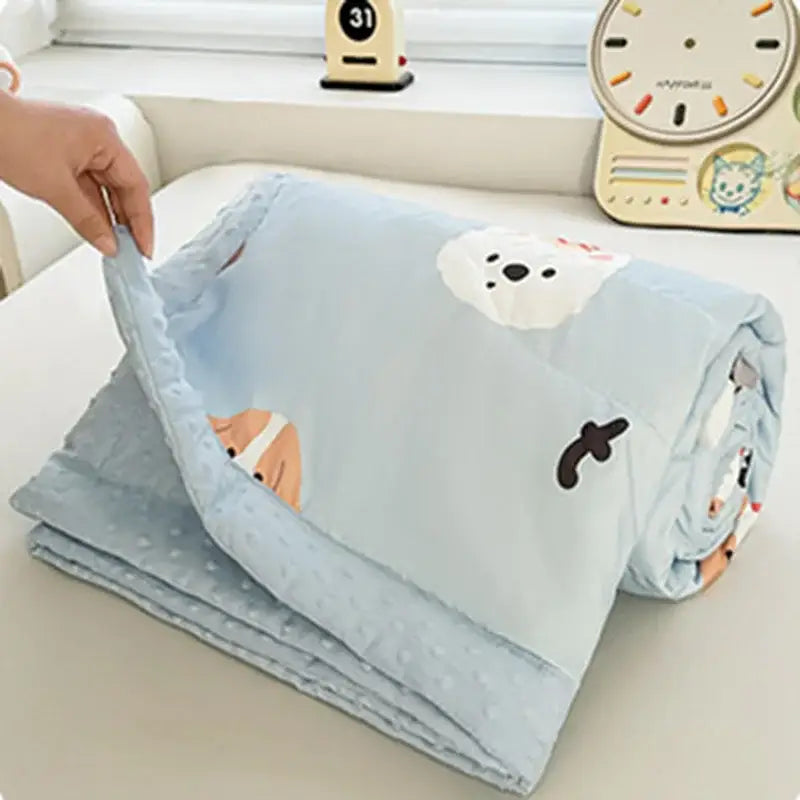 Cream cartoon pattern summer quilt in light blue with soft plush texture and decorbites cartoon pattern prints