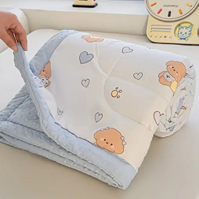 Cream cartoon pattern summer quilt in light blue and white featuring cartoon pattern decorbites poodles on soft fabric
