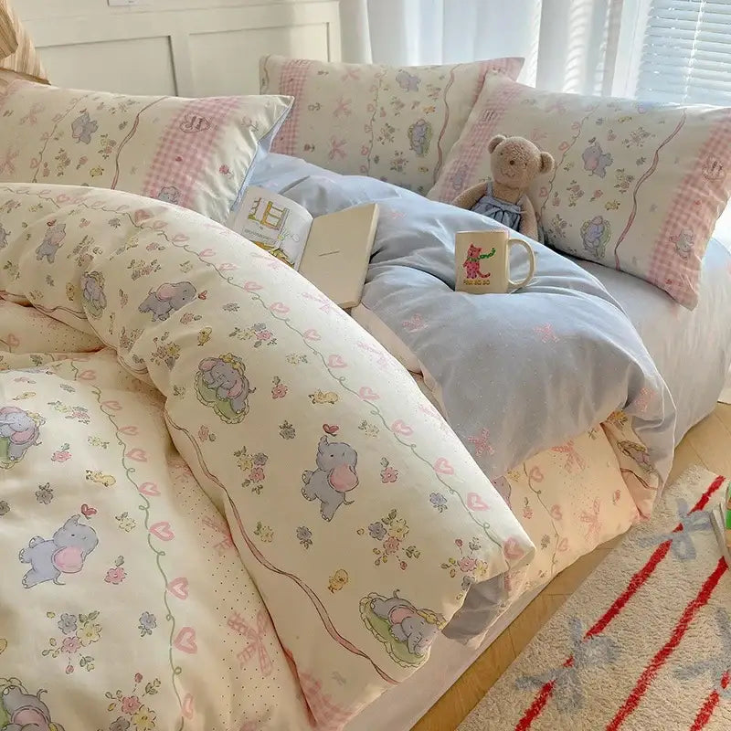 Pastel-colored cartoon printed cotton bedding set with cream elephant and floral decorbites cartoon printed design