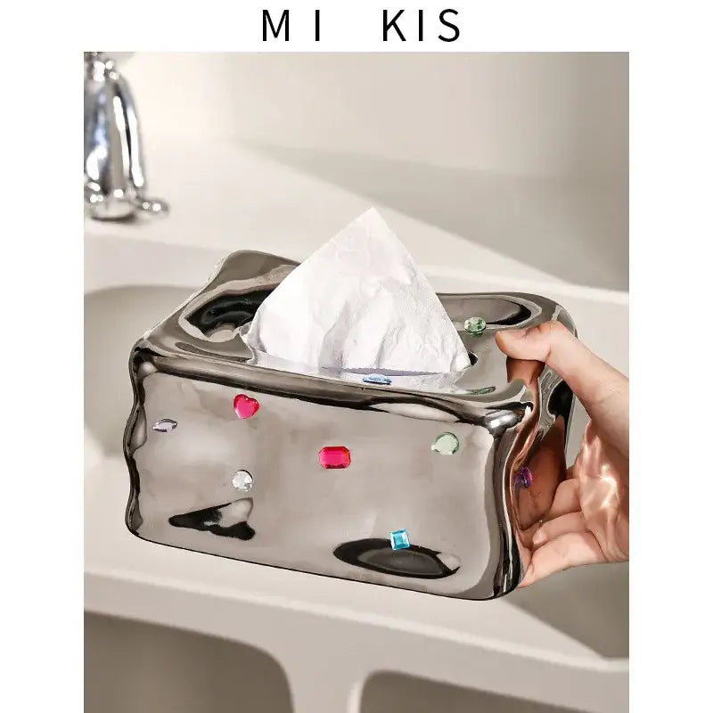 Shiny metallic gemstone tissue box with sculpted heart design and colorful accents for decorbites heart gemstone decor