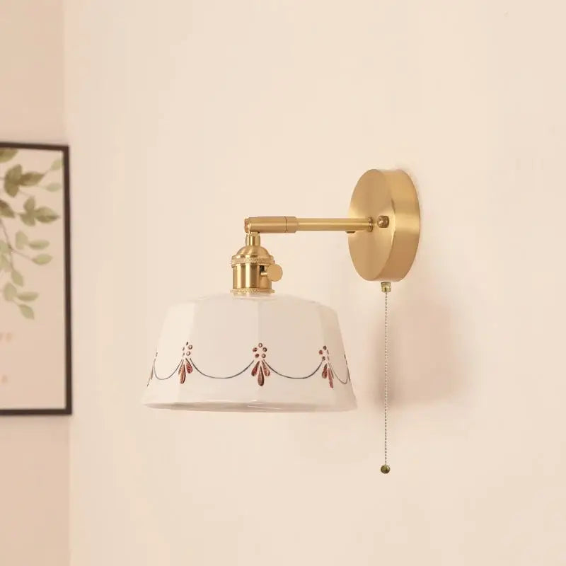 Cream ceramic led wall lamps with decorative brown floral motifs on a white ceramic shade for bedroom decorbites ceramic led