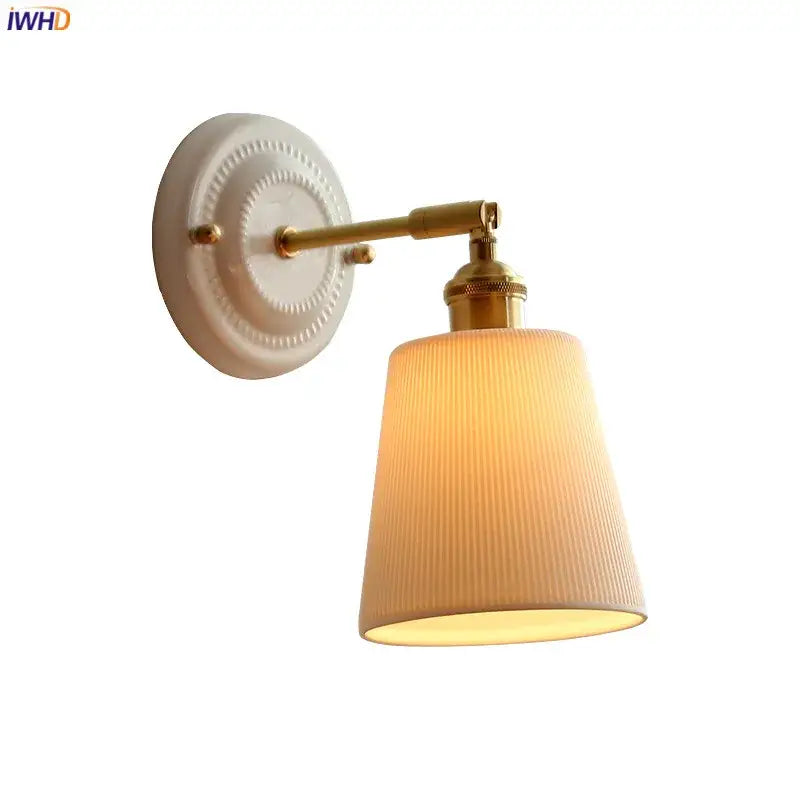 Cream ceramic led wall light with copper arm featuring a vintage-style cream ribbed fabric shade and brass hardware by decorbites ceramic led