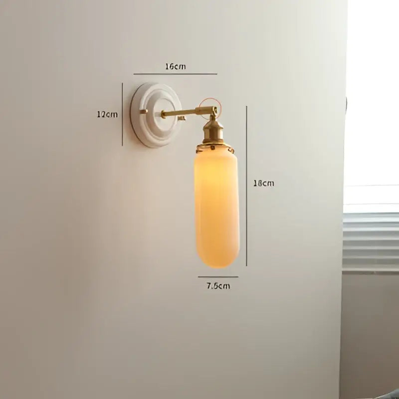 Cream ceramic led wall light with copper arm featuring a vintage brass sconce and warm amber glass shade for bedroom decorbites ceramic led