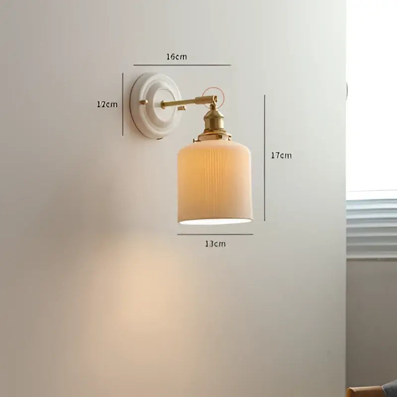 Vintage-style cream ceramic led wall light with copper arm and off-white ribbed glass shade by decorbites ceramic led