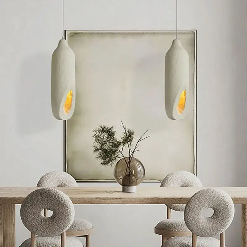 Cream ceramic pendant light with warm yellow glow decorbites cement handmade led for living room decor