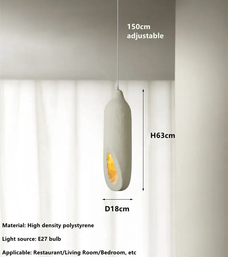 Cream ceramic pendant light by decorbites cement handmade with off-white oval shape and amber glowing interior
