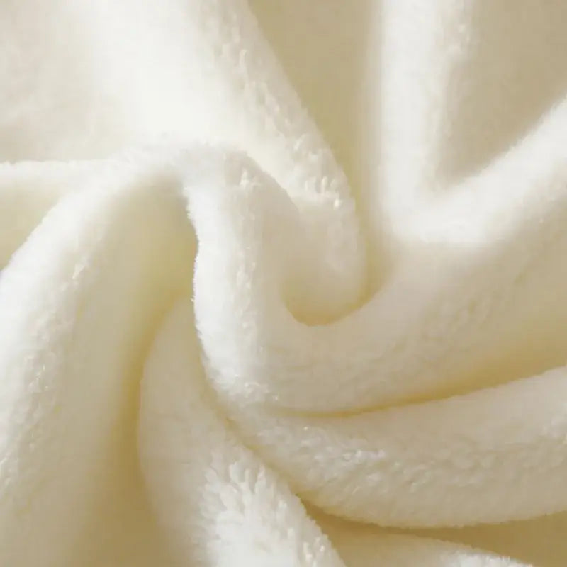 Cream cherry velvet embroidered blanket with cream-colored plush fleece surface and pom pom trim ideal for baby velvet use