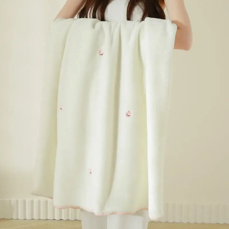 Cream cherry velvet embroidered blanket featuring off-white baby velvet with pink embroidered foxes and trim edges