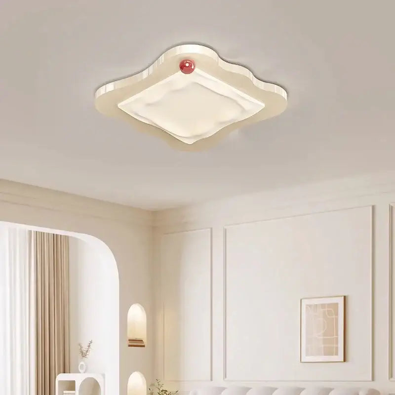 Cream cloud led ceiling light with a glossy finish and a red accent for decorbites cream led bedroom decor