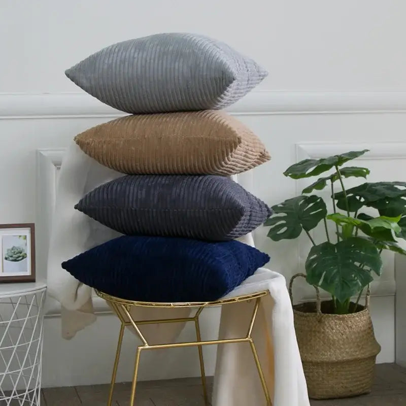 Stack of four corduroy striped cushion covers in gray tan navy blue and dark blue for living room decorbites throw pillows