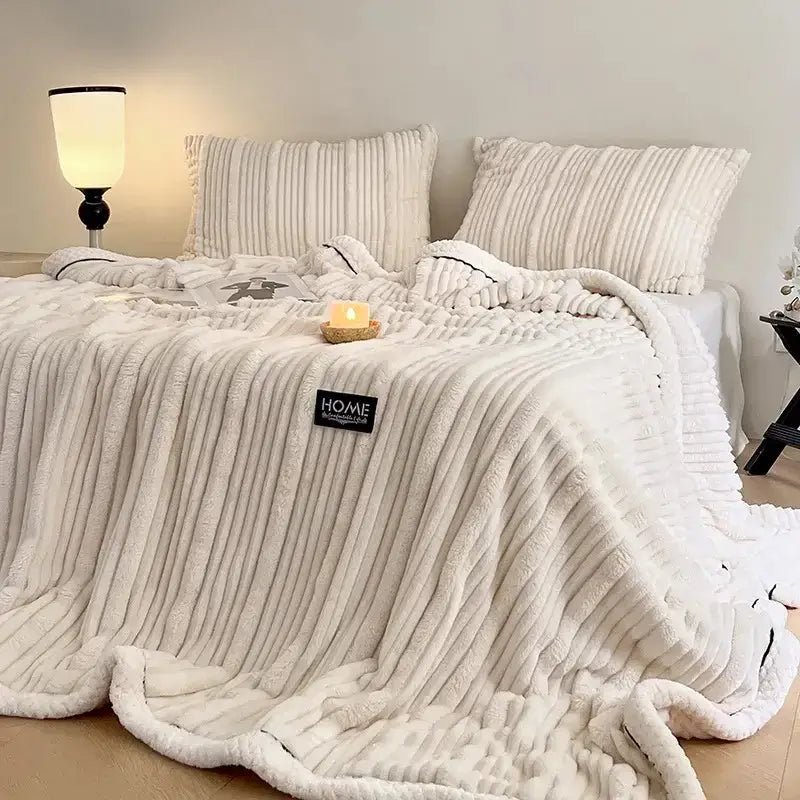 Cream cozy faux rabbit plush blanket with cream-colored plush corduroy and black piping edge for decorbites cozy faux use