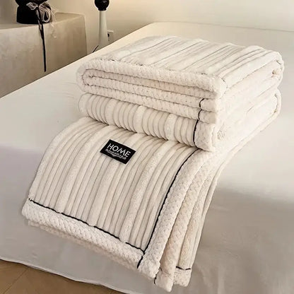 Cream cozy faux rabbit plush blanket with ribbed texture and black stitched trim for decorbites cozy faux bedroom use
