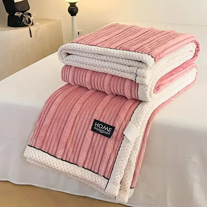 Cream cozy faux rabbit plush blanket with pink and white ribbed fleece and black piping edge for comfortable decorbites cozy faux use