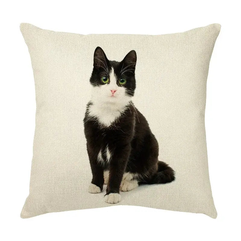 Beige linen throw pillow with cute cat face decorative print of black and white cat with green eyes for living room