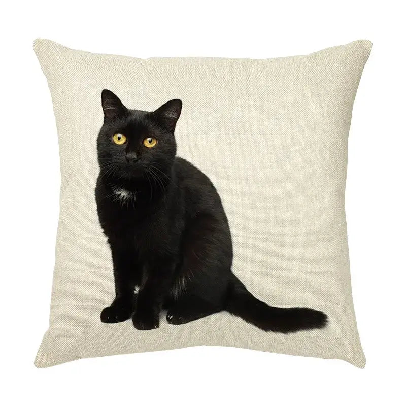 Cream beige linen throw pillow with a cute cat face decorative print featuring a black cat with yellow eyes
