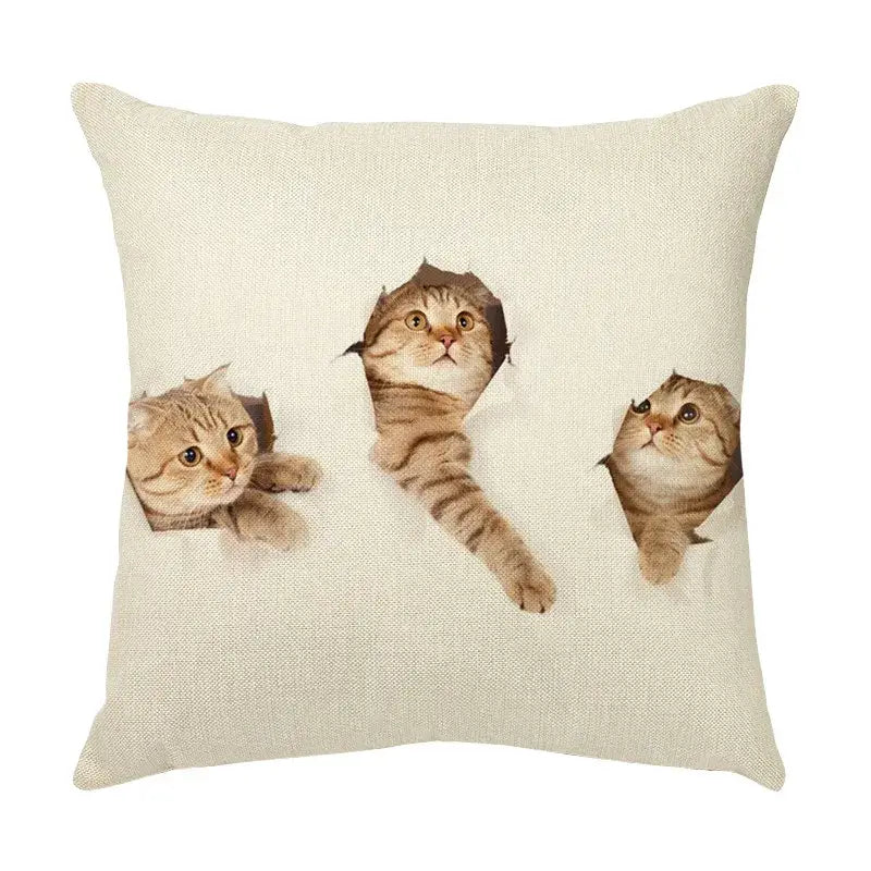 Beige linen throw pillow with cute cat face design of three tabby cats peeking through torn paper holes